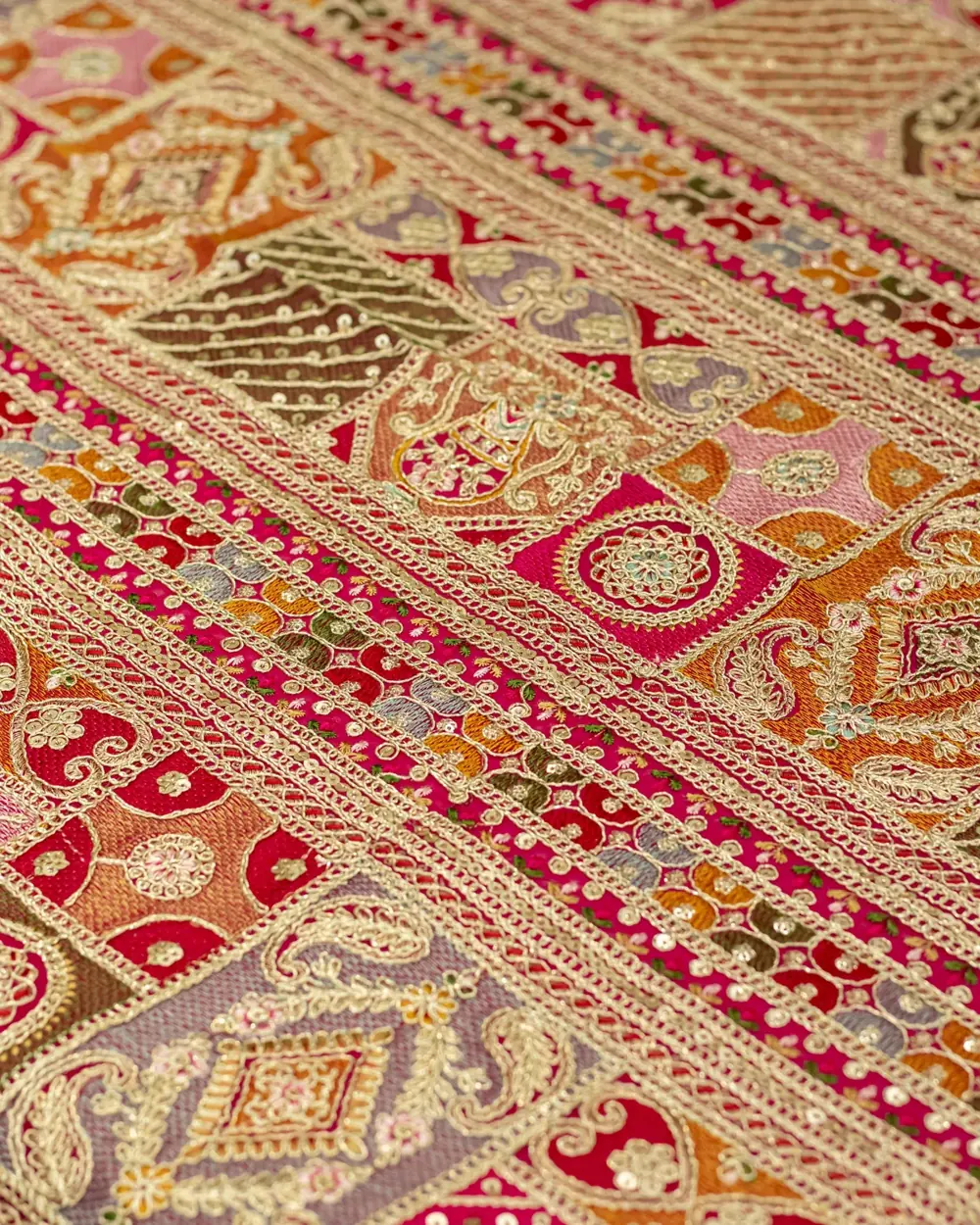 Georgette fabric with multicoloured panel embroidery and gold thread borders
