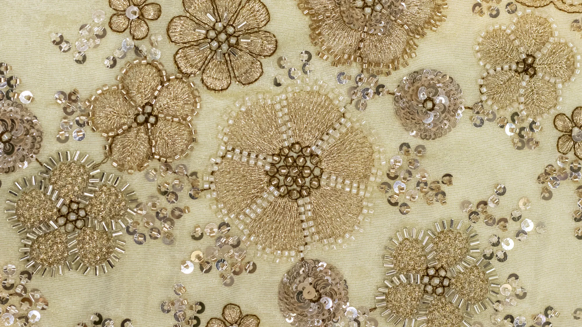 Ivory designer fabric embroidered with gold floral zardozi and sequin work
