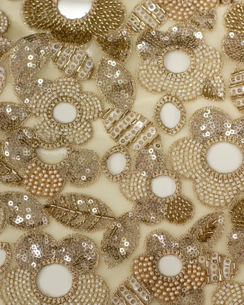 Net fabric embroidered with gold sequin and pearl bead floral motifs